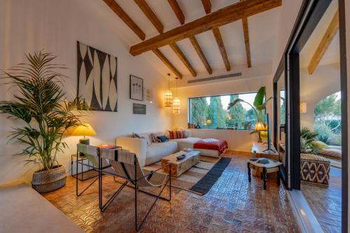 a living room with a couch and a table at Naraya - Managed By Almarina Villas in Jávea