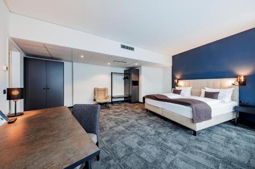 Postel nebo postele na pokoji v ubytování Hotel am Borsigturm