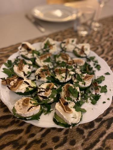 a plate of food with mushrooms on a table at B&B Clos Emilion et table d'hôte en option in Vignonet