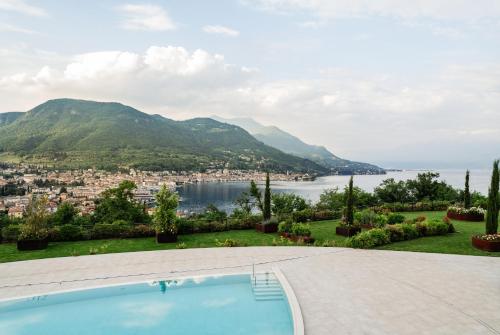 a view from a villa with a swimming pool at A-ROSA Gardasee in Salò
