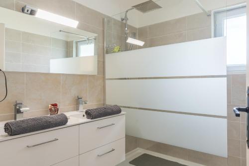 a bathroom with a sink and a mirror at Mas Provençal in Saint-Rémy-de-Provence