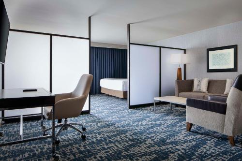 a hotel room with a bed and a desk at Hyatt Regency DFW International Airport in Dallas