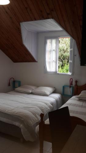 Postel nebo postele na pokoji v ubytování Au point de vue Cilaos
