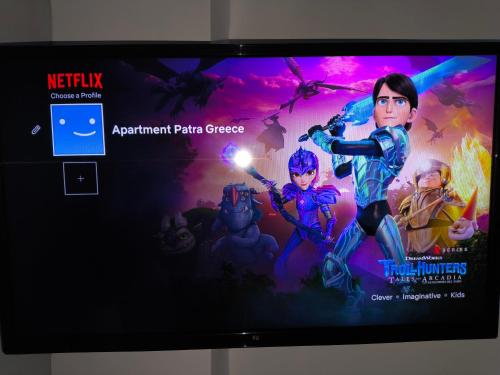 a tv with a video game on the screen at Apartment Patra Greece in Patra