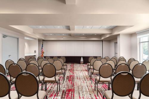 a room with rows of chairs and a stage at Hilton Garden Inn Rock Hill in Rock Hill