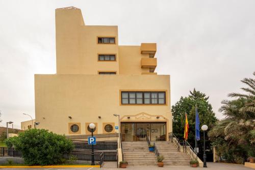 a building with stairs in front of a building at Parador de Melilla in Melilla