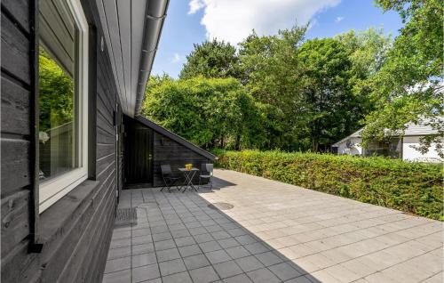 a patio on the side of a house at Amazing Home In Farsø With Wifi in Farsø