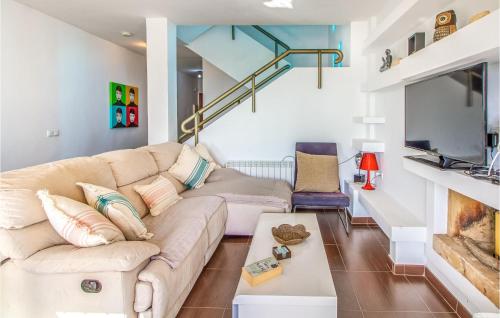 a living room with a couch and a table at Nice Home In San Javier With Wifi in San Javier