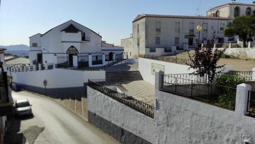 arial view of a city with a building and a street at Alojamientos Rurales Los Molinos in Fuentes de León