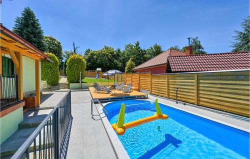 a swimming pool with a slide in a house at Beautiful Home In Imbriovec Jalzabetski in Imbrijovec Jalžabetski
