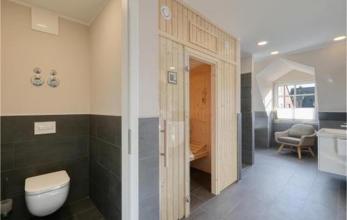 a bathroom with a toilet and a sink at Baltischer Hof Apartment 47 in Boltenhagen
