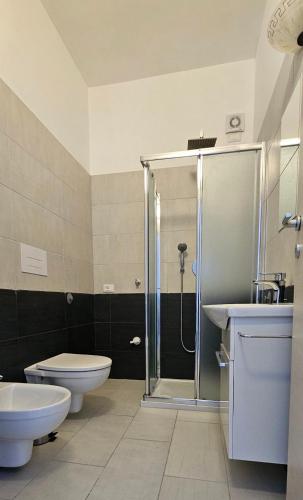 a bathroom with a shower and a toilet and a sink at Villa Jolanda in Citta' Sant'Angelo