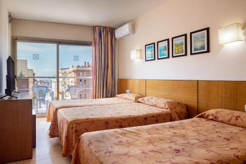Postel nebo postele na pokoji v ubytování htop Palm Beach & SPA #htopEnjoy