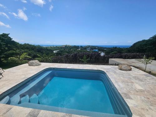 a swimming pool sitting on top of a patio at Casa Aramana in Vieques