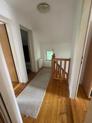 an empty room with a staircase and a rug at Villa RELAX Miševići in Sarajevo