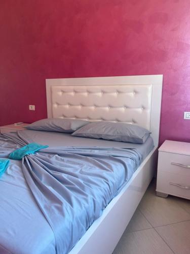 Ένα ή περισσότερα κρεβάτια σε δωμάτιο στο Kena Apartments - Lura 2 Resort
