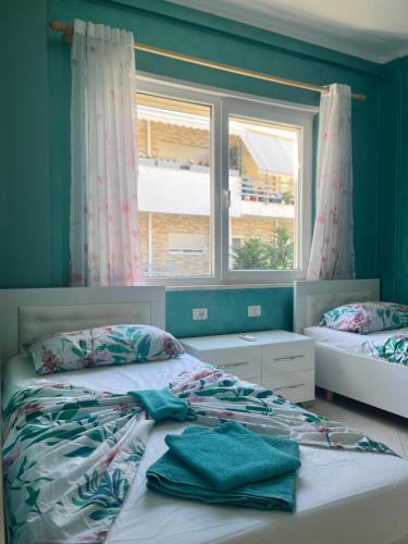 Ένα ή περισσότερα κρεβάτια σε δωμάτιο στο Kena Apartments - Lura 2 Resort