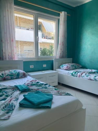 Ένα ή περισσότερα κρεβάτια σε δωμάτιο στο Kena Apartments - Lura 2 Resort