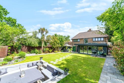 an image of a house with a garden at Gatsby Villa with large garden and fancy hot tub in Chislehurst