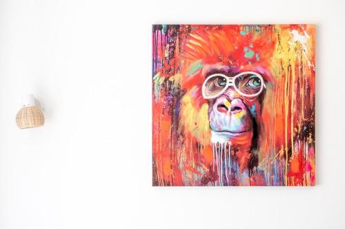 a painting of a monkey wearing glasses at OIQIA • Castela in Pamiers