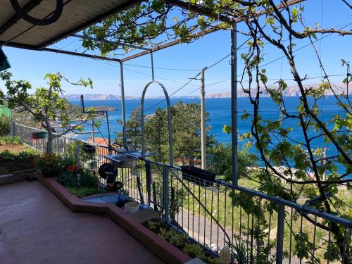 a balcony with a view of the water at Apartment Tina Sveti Juraj in Senj