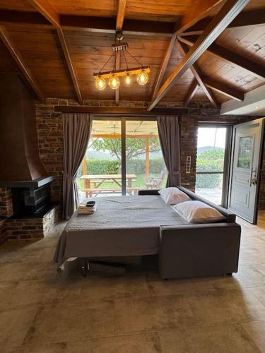 a bedroom with a large bed in a room at Villa Bournous in Mesokhória