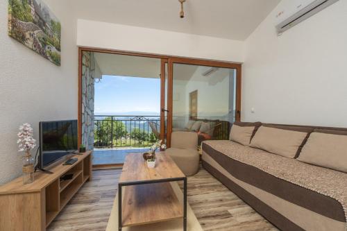 TV a/nebo společenská místnost v ubytování Jasen Apartments Lakeview