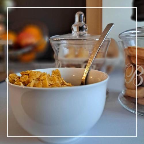 a bowl of food with a spoon in it at Le Regina Hôtel restaurant in Hardelot-Plage