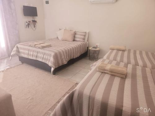 Postel nebo postele na pokoji v ubytování Opiepad Guesthouse