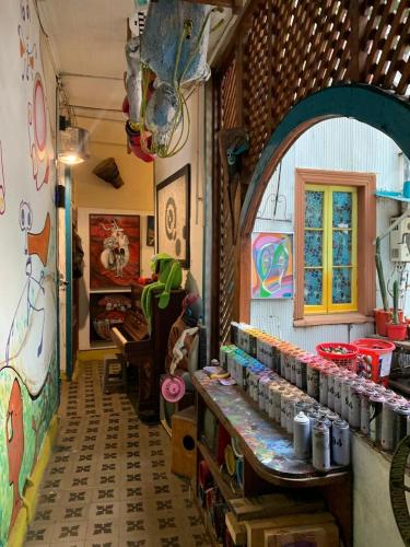 a store with paintings on the walls and a room at Art Hostel Casa Chaman in Valparaíso