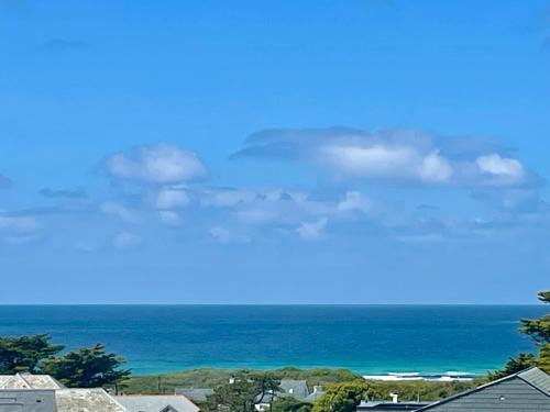 a view of the ocean from a house at Sea view apartment, first floor in Saint Merryn
