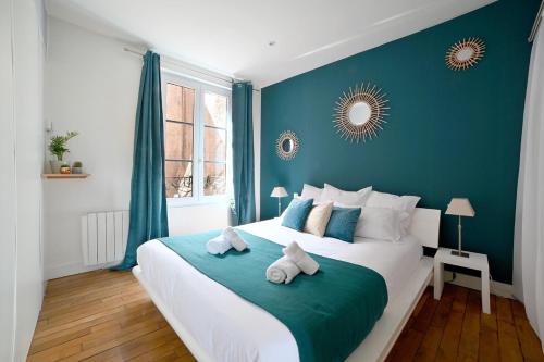 En eller flere senge i et værelse på Le Collectionneur