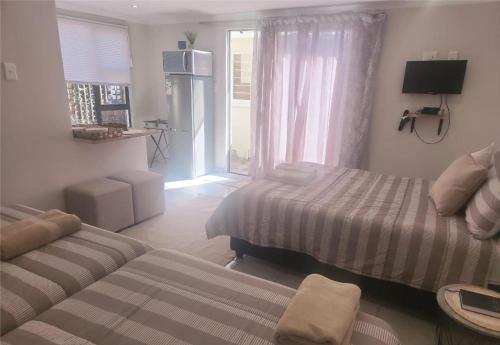Postel nebo postele na pokoji v ubytování Opiepad Guesthouse