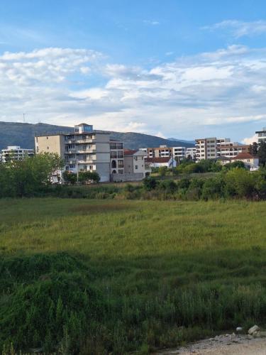 a view of a city with buildings in a field at Kan&Dzan Apartmani in Ulcinj