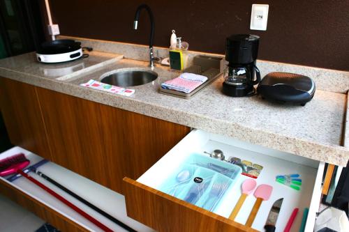 a kitchen counter with a sink and a drawer at Rooftop103-Tamandaré in Tamandaré