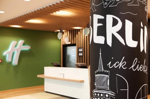 an office with a sign with the eiffel tower at Holiday Inn Berlin City East Side by IHG in Berlin