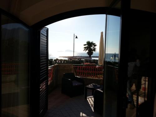 a view of the beach from the balcony of a hotel at Hotel Tirreno Formia in Formia