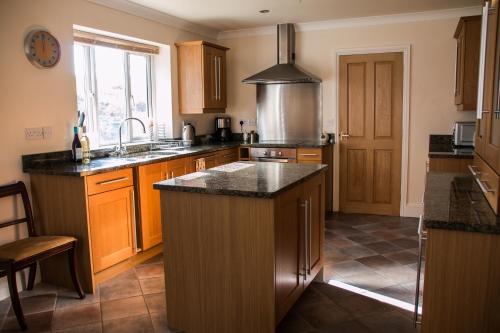 a kitchen with a sink and a counter top at Applewood in Much Wenlock