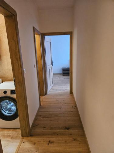 a hallway leading to a room with an open door at Apartmány Skalica in Skalica