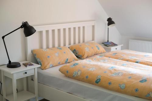 Postel nebo postele na pokoji v ubytování Gut Herbigshagen - Sielmann Appartement