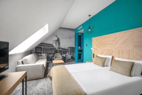 a bedroom with a large bed and a blue wall at T62 Hotel in Budapest