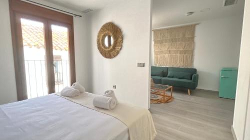 a bedroom with a large bed and a couch at Selecta Marbella Sentire Apartaments in Marbella
