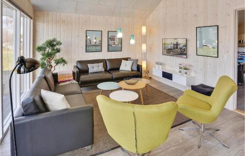 a living room with a couch and chairs at Nice Home In Bogense With Kitchen in Skåstrup
