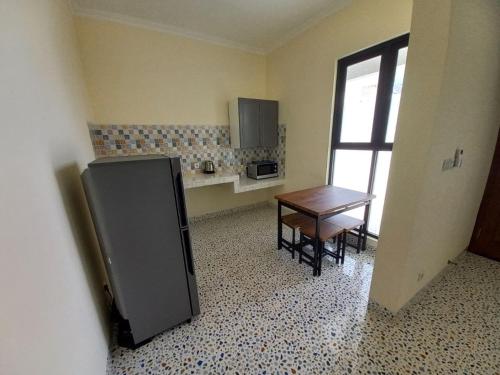 Кухня или мини-кухня в Guesthouse Jogja Selatan 1 Yogya South Bantul Casa del Oceano
