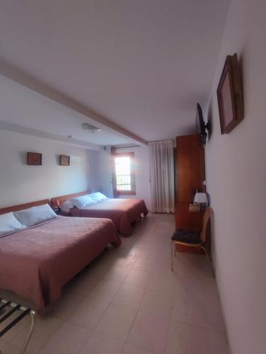 a bedroom with two beds and a window at Antica Raffineria in Venice