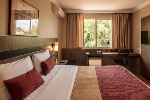 Postel nebo postele na pokoji v ubytování Hotel Deville Express Cascavel