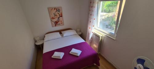 Posteľ alebo postele v izbe v ubytovaní Apartment Sime