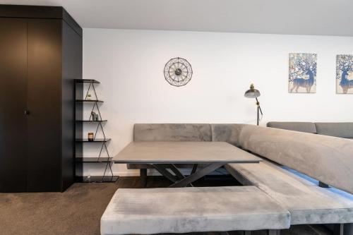 a living room with a couch and a table at Park Avenue Apt in the Heart of the City - Hosted by CanStay in Canberra