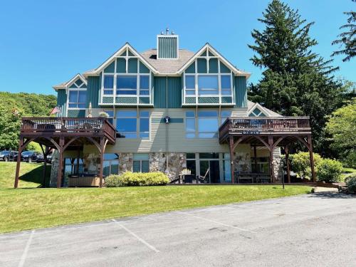 a large house with two balconies on a street at Center Stage in McHenry