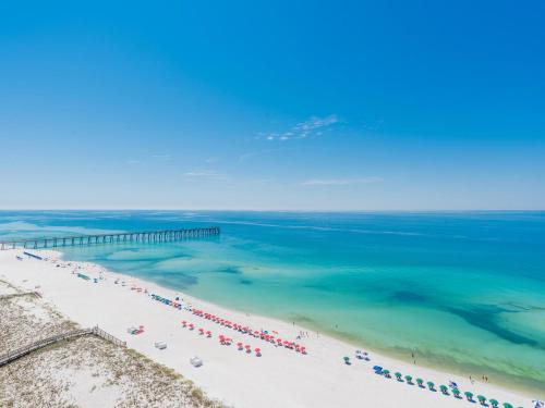 an aerial view of a beach with a pier at The Pearl of Navarre #1403 in Navarre